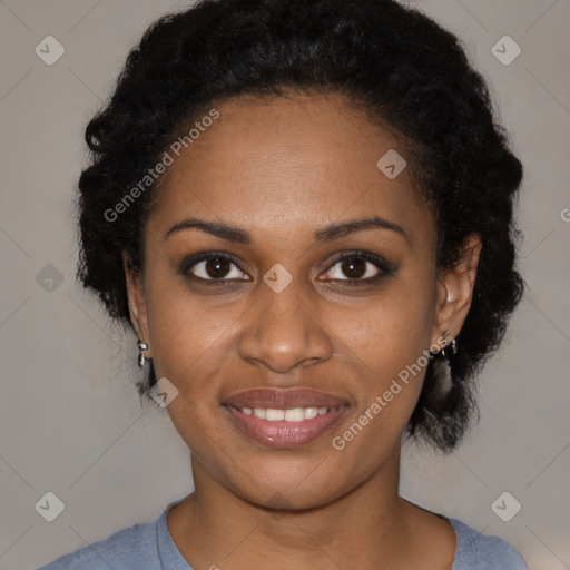 Joyful black young-adult female with medium  black hair and brown eyes