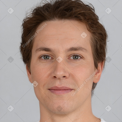 Joyful white adult male with short  brown hair and brown eyes