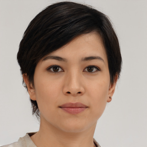 Joyful asian young-adult female with medium  brown hair and brown eyes
