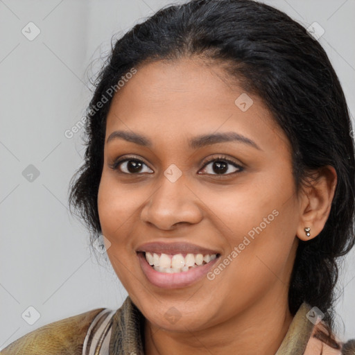 Joyful latino young-adult female with medium  brown hair and brown eyes