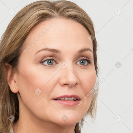 Joyful white young-adult female with long  brown hair and blue eyes