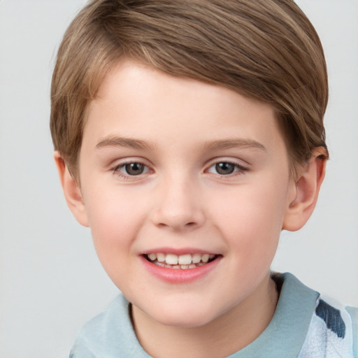 Joyful white child female with short  brown hair and grey eyes