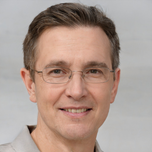 Joyful white middle-aged male with short  brown hair and grey eyes