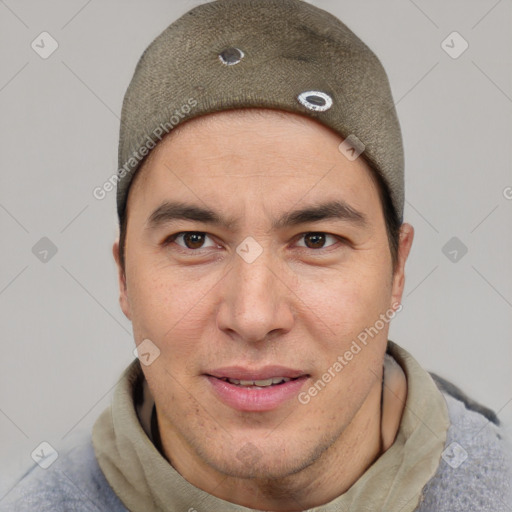 Joyful asian young-adult male with short  brown hair and brown eyes