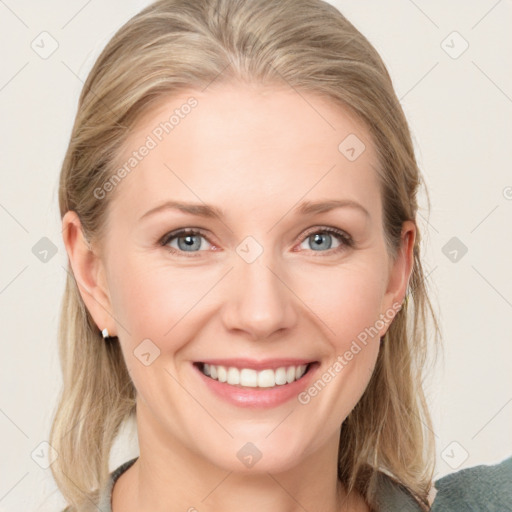 Joyful white young-adult female with medium  brown hair and blue eyes