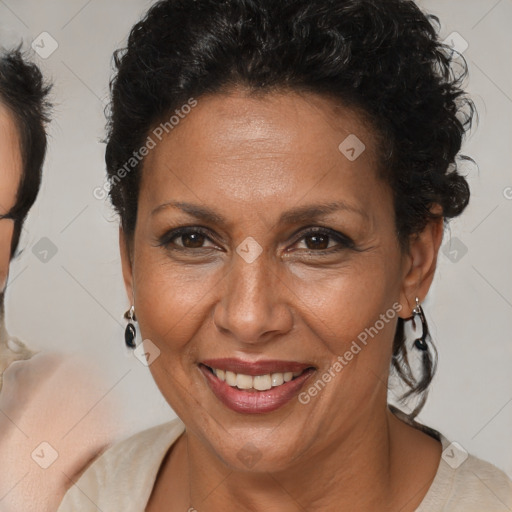 Joyful black adult female with short  brown hair and brown eyes