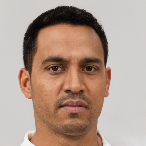 Neutral latino young-adult male with short  brown hair and brown eyes