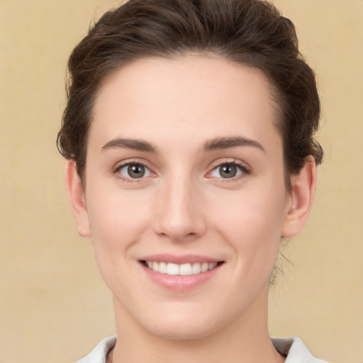 Joyful white young-adult female with short  brown hair and brown eyes