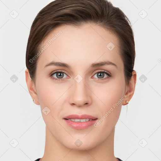 Joyful white young-adult female with short  brown hair and grey eyes