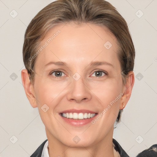 Joyful white adult female with short  brown hair and brown eyes