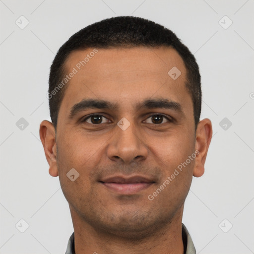 Joyful latino young-adult male with short  black hair and brown eyes