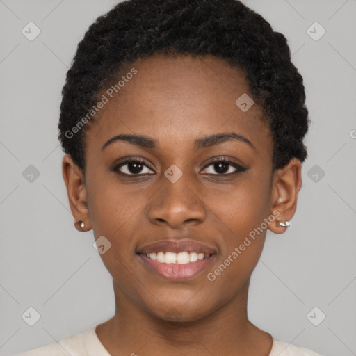 Joyful black young-adult female with short  black hair and brown eyes