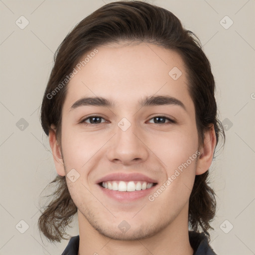 Joyful white young-adult male with medium  brown hair and brown eyes