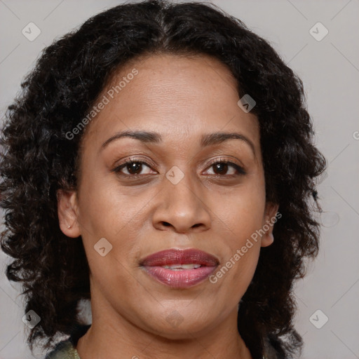 Joyful black adult female with medium  brown hair and brown eyes