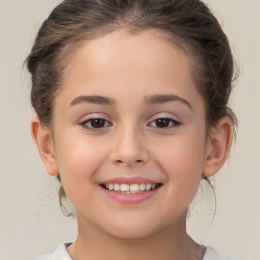 Joyful white child female with medium  brown hair and brown eyes