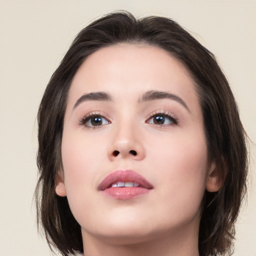 Neutral asian young-adult female with medium  brown hair and brown eyes