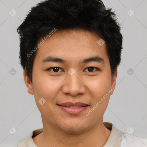 Joyful asian young-adult male with short  black hair and brown eyes