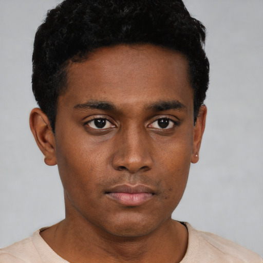Neutral black young-adult male with short  black hair and brown eyes