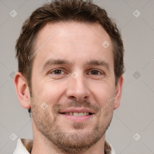 Joyful white adult male with short  brown hair and grey eyes