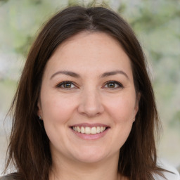 Joyful white young-adult female with medium  brown hair and brown eyes