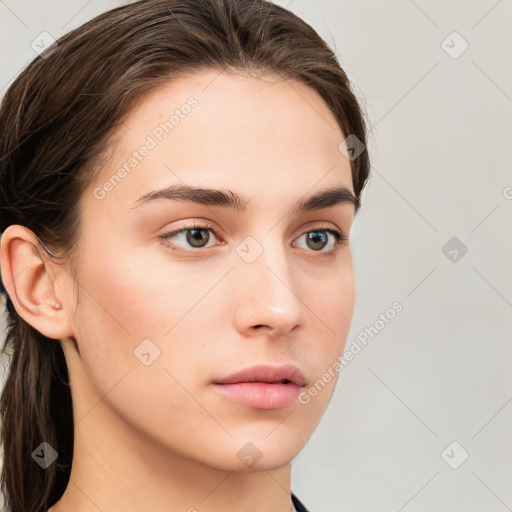 Neutral white young-adult female with long  brown hair and grey eyes