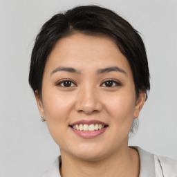 Joyful white young-adult female with medium  brown hair and brown eyes