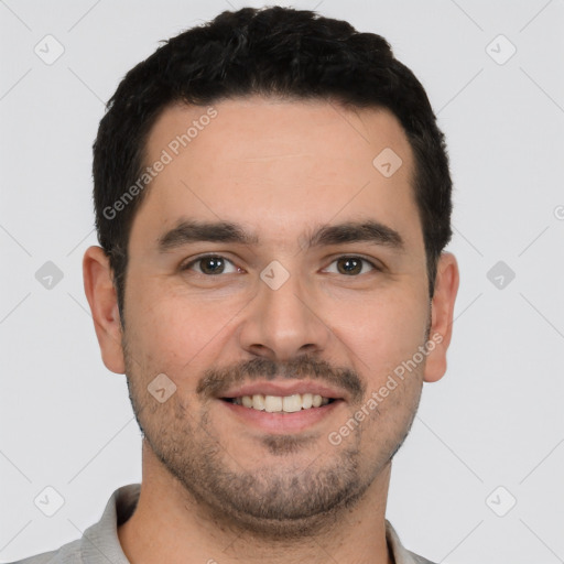 Joyful white young-adult male with short  black hair and brown eyes