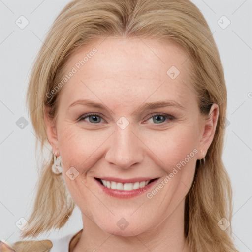 Joyful white young-adult female with long  brown hair and blue eyes