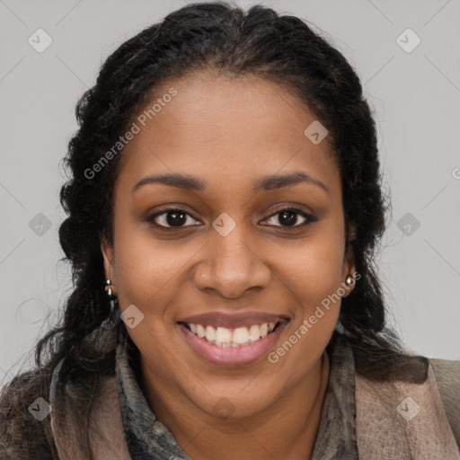 Joyful black young-adult female with long  brown hair and brown eyes