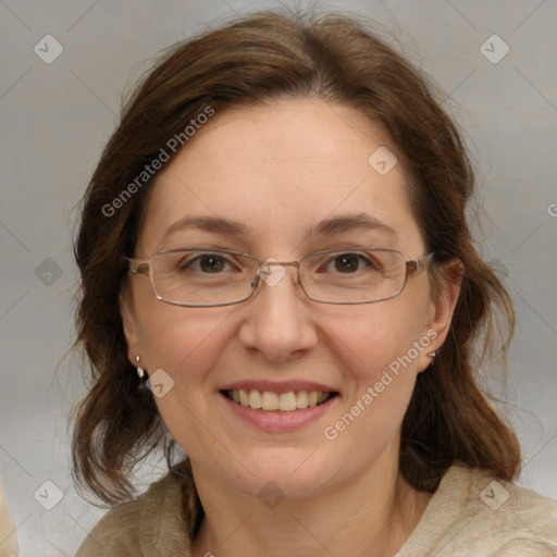 Joyful white adult female with medium  brown hair and grey eyes