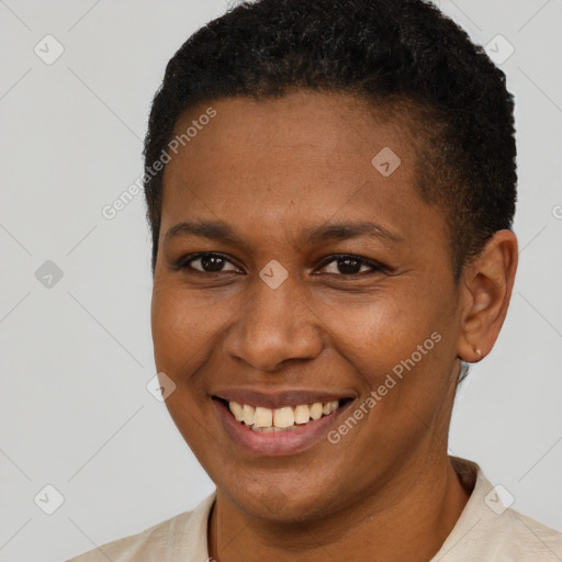 Joyful black young-adult female with short  brown hair and brown eyes