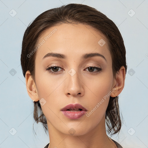 Neutral white young-adult female with medium  brown hair and brown eyes