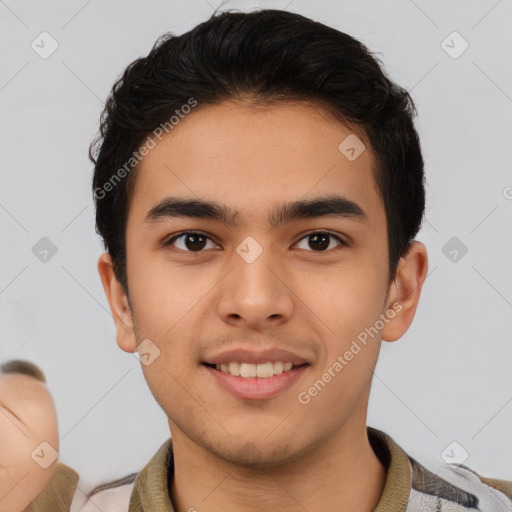 Joyful asian young-adult male with short  brown hair and brown eyes