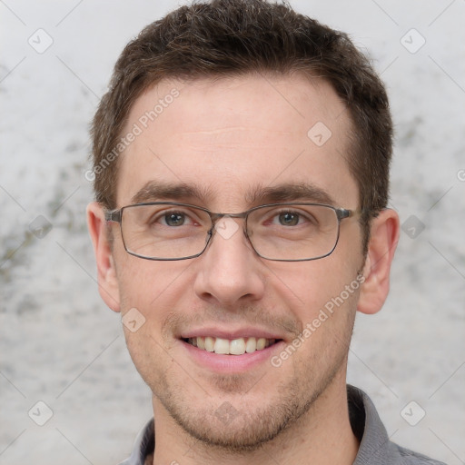 Joyful white adult male with short  brown hair and grey eyes