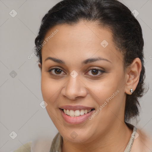 Joyful latino young-adult female with medium  brown hair and brown eyes