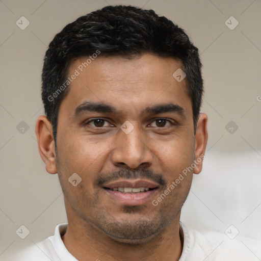 Joyful latino young-adult male with short  black hair and brown eyes