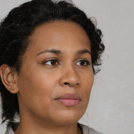 Neutral latino young-adult female with short  brown hair and brown eyes