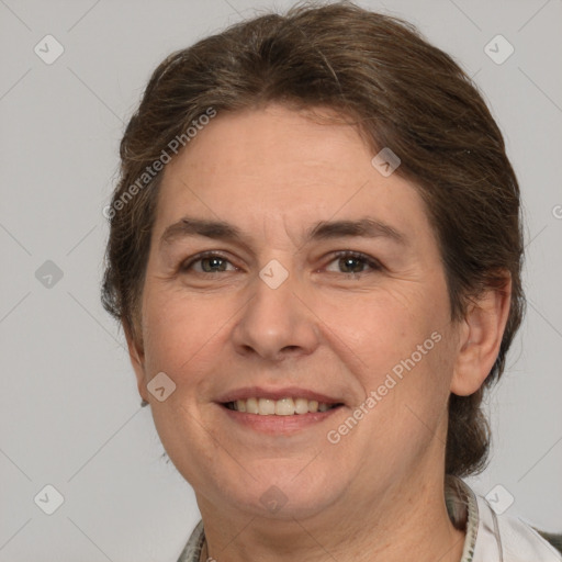 Joyful white adult female with short  brown hair and brown eyes