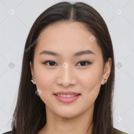 Joyful asian young-adult female with long  brown hair and brown eyes