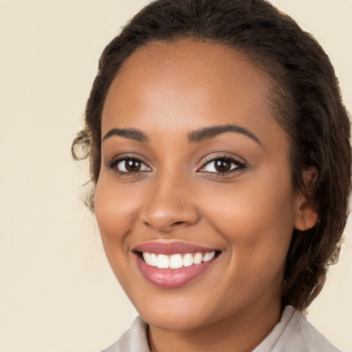 Joyful white young-adult female with long  brown hair and brown eyes