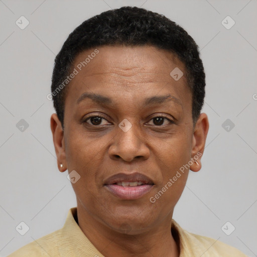 Joyful black adult female with short  black hair and brown eyes