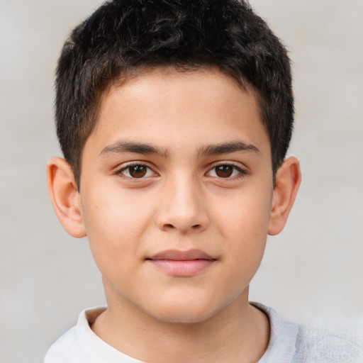 Joyful white child male with short  brown hair and brown eyes