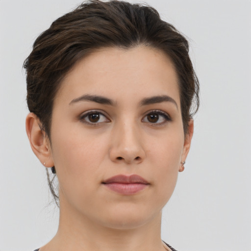 Neutral white young-adult female with short  brown hair and brown eyes