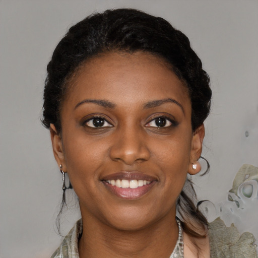 Joyful black young-adult female with medium  black hair and brown eyes