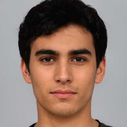 Neutral white young-adult male with short  black hair and brown eyes