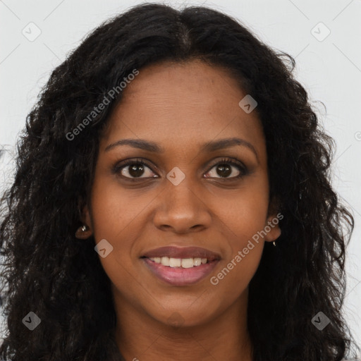 Joyful black young-adult female with long  brown hair and brown eyes