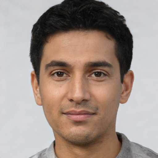 Neutral latino young-adult male with short  black hair and brown eyes