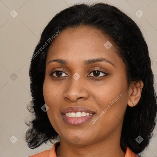 Joyful black young-adult female with medium  black hair and brown eyes