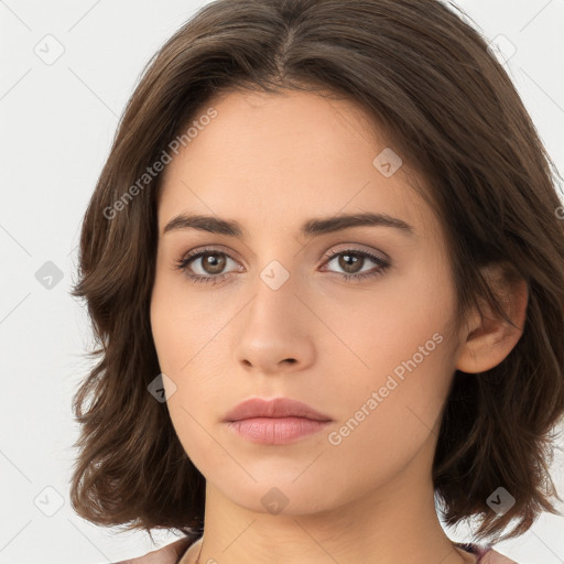 Neutral white young-adult female with long  brown hair and brown eyes