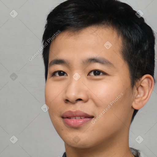 Joyful asian young-adult male with short  black hair and brown eyes